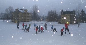 kids on skis during snowstorm