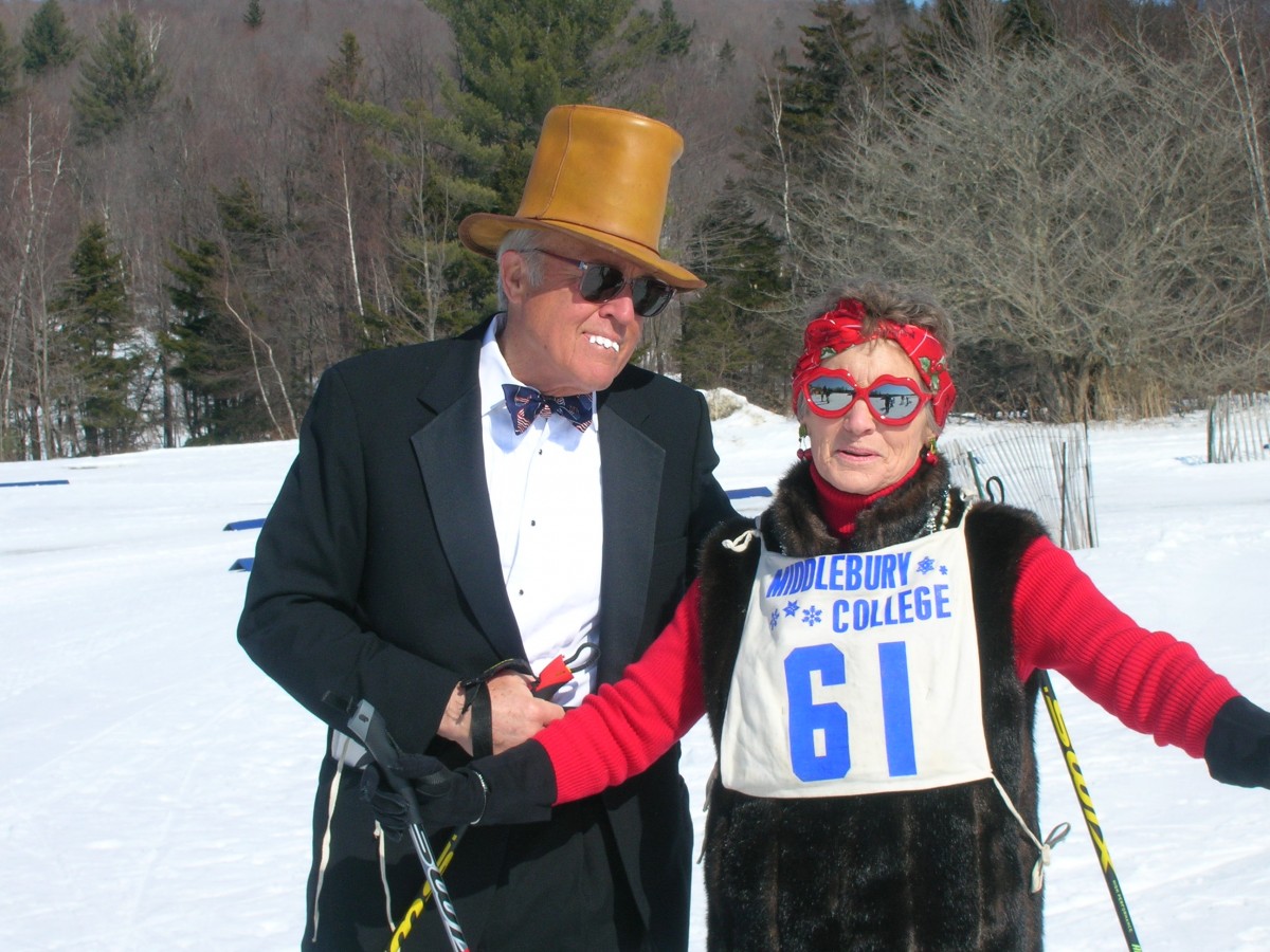 Nordic skiing couple dressed in black tie.